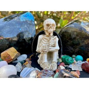 Sitting Skeleton with Bat Wings Statue 3.85"